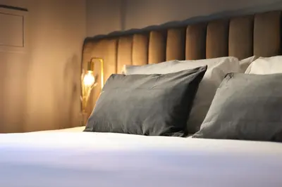 Letto o letti in una camera di Quatrum Napoli - B&B