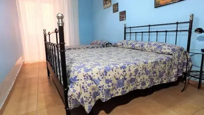 Letto o letti in una camera di casa Ersilia