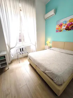Letto o letti in una camera di Agorà