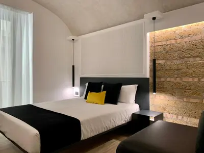 Letto o letti in una camera di Toledo Boutique Rooms