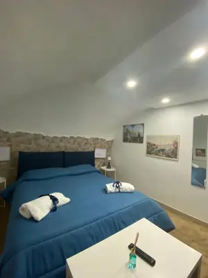 Letto o letti in una camera di Una Notte a Napoli