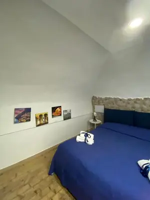 Letto o letti in una camera di Una Notte a Napoli