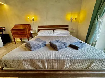 Letto o letti in una camera di Venustas Napoli Toledo