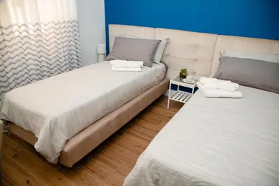 Letto o letti in una camera di Belvedere 75