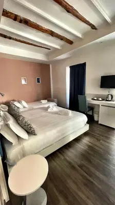Letto o letti in una camera di Palazzo Cappuccini Art Relais