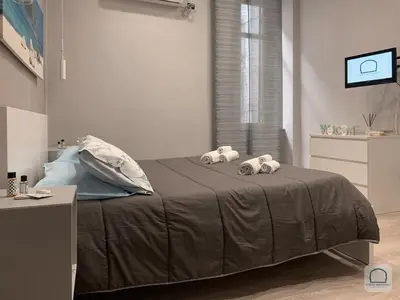 Letto o letti in una camera di Borgo Antignano