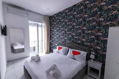 Letto o letti in una camera di B&B AMORE