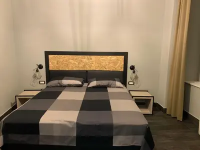 Letto o letti in una camera di La Terrazza di Parthenope