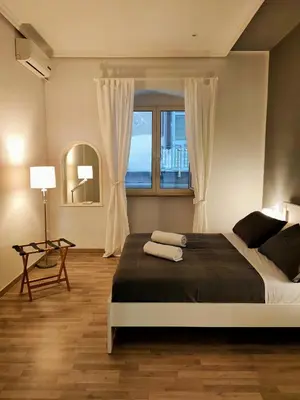 Letto o letti in una camera di Pithecusa Home