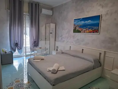 Letto o letti in una camera di Napoli central