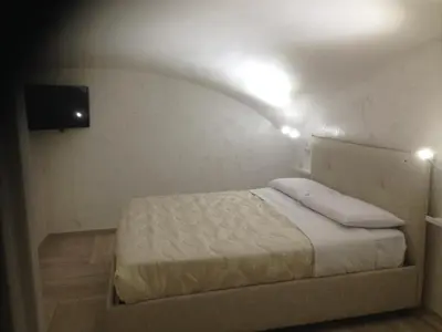 Letto o letti in una camera di Casa Vacanze Piedigrotta 57