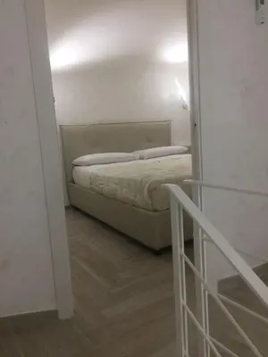 Letto o letti in una camera di Casa Vacanze Piedigrotta 57