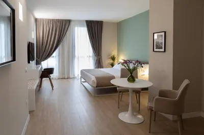 Letto o letti in una camera di Alma Suites