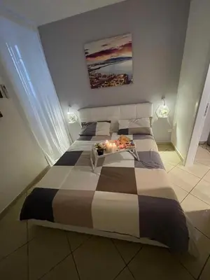 Letto o letti in una camera di HOME SWEET HOME Storia di Napoli