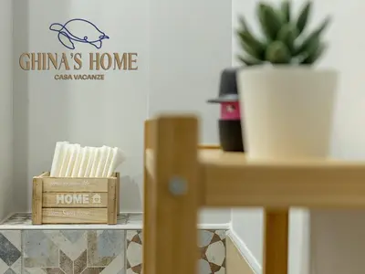 Certificato, attestato, insegna o altro documento esposto da Ghina's home