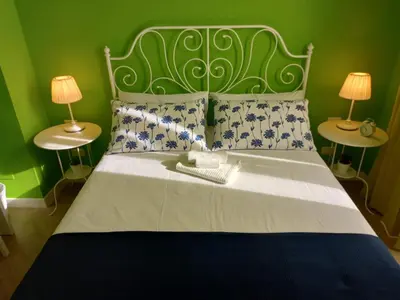 Letto o letti in una camera di B&B Stella Scugnizza
