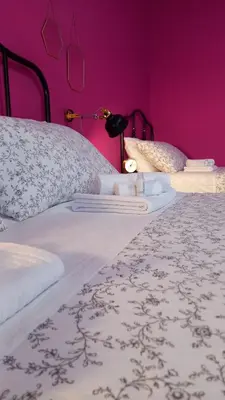 Letto o letti in una camera di B&B Stella Scugnizza