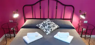 Letto o letti in una camera di B&B Stella Scugnizza
