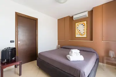 Letto o letti in una camera di N'Attic a Vomero Penthouse Terrace by Napoliapartments