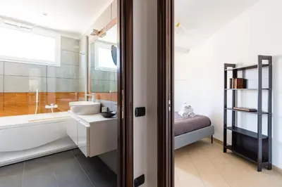 Letto o letti in una camera di N'Attic a Vomero Penthouse Terrace by Napoliapartments