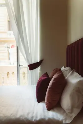 Letto o letti in una camera di Palazzo Nanà Suites & Apartments