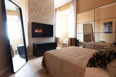Letto o letti in una camera di Palazzo Nanà Suites & Apartments