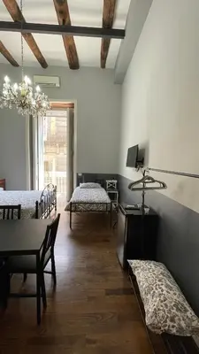Letto o letti in una camera di Anima Partenopea