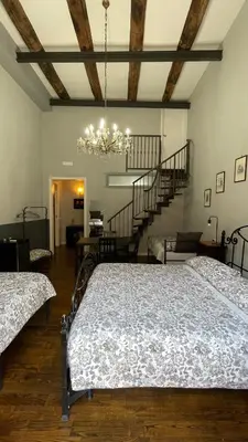 Letto o letti in una camera di Anima Partenopea