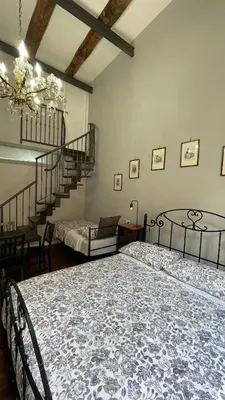 Letto o letti in una camera di Anima Partenopea