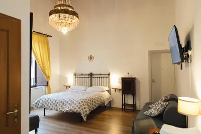 Letto o letti in una camera di Relais CuoreNapoletano