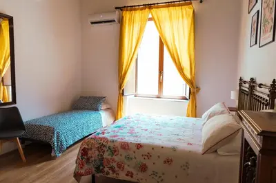 Letto o letti in una camera di Relais CuoreNapoletano