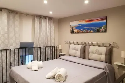 Letto o letti in una camera di Sisella basso suite dayuse