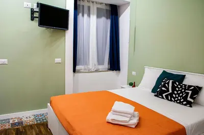 Letto o letti in una camera di Inner Naples
