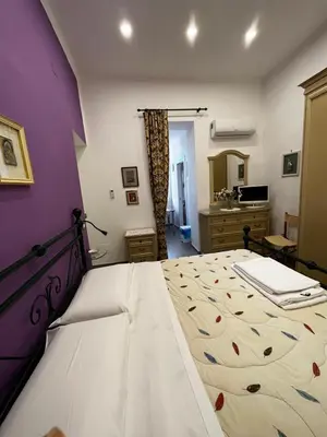 Letto o letti in una camera di In pieno centro storico - la casa di Anna