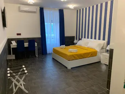 Letto o letti in una camera di Yacht Club Angioino