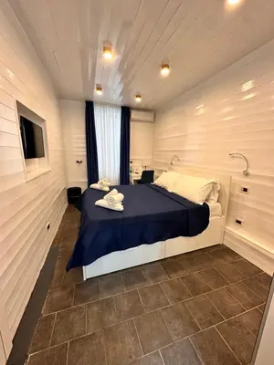 Letto o letti in una camera di Yacht Club Angioino