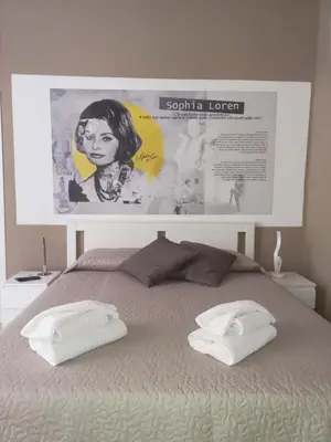 Letto o letti in una camera di Le stanze di Partenope