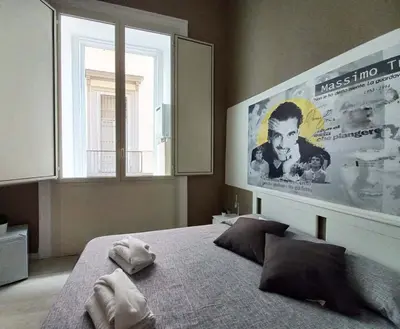 Letto o letti in una camera di Le stanze di Partenope