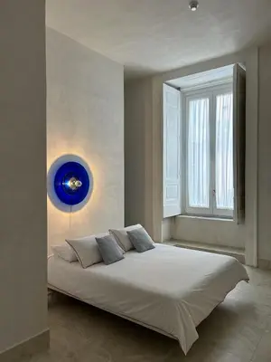 Letto o letti in una camera di Casa Celeste Aida