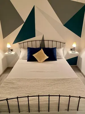 Letto o letti in una camera di Figurari Home Napoli