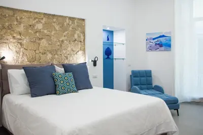 Letto o letti in una camera di Blue Plebiscito