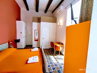 Letto o letti in una camera di Napoli naif