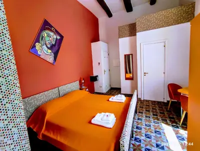 Letto o letti in una camera di Napoli naif