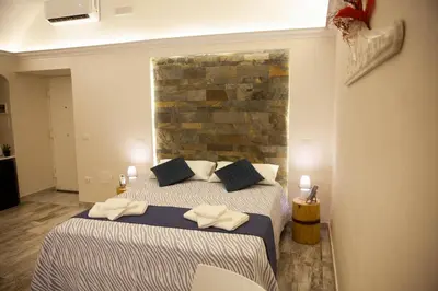 Letto o letti in una camera di Plebiscito House - Casa Vacanze Napoli