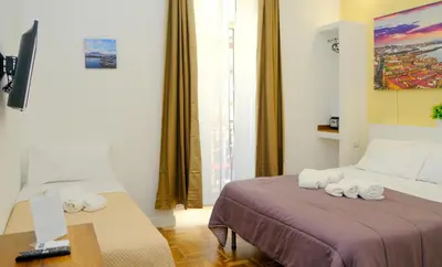 Letto o letti in una camera di B&b Onda Napoli