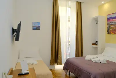 Letto o letti in una camera di B&b Onda Napoli