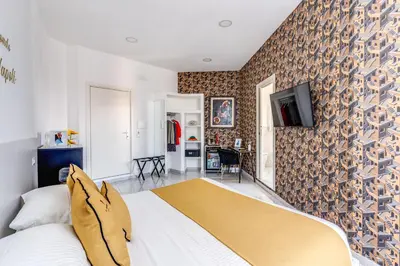 TV o dispositivi per l'intrattenimento presso Le Angioine Rooms
