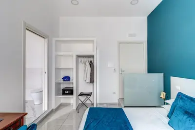 Letto o letti in una camera di Le Angioine Rooms