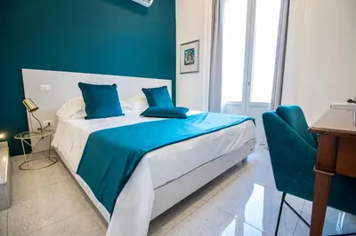 Letto o letti in una camera di Le Angioine Rooms