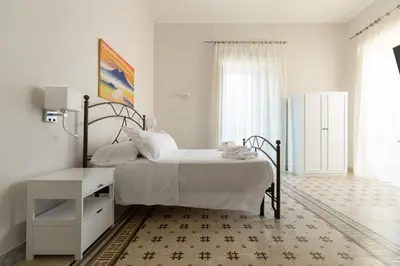 Letto o letti in una camera di EFFE SUITES